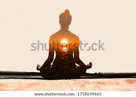 Yoga day concept. Multiple exposure image. Woman practicing yoga at sunset Royalty-Free Stock Photo #1758639665