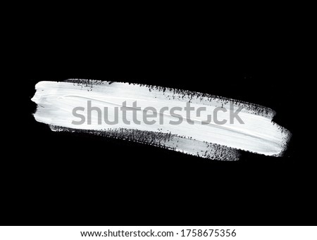 White oil paint smudge over black background. Image. Royalty-Free Stock Photo #1758675356