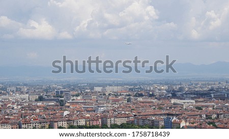 An aerial beautiful shot of a cityscape under a cloudy sky at daytime