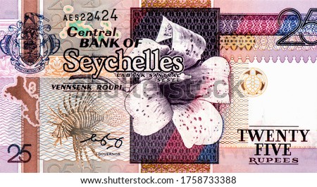 Wrights gardenia flower, Lion fish, Portrait from Seychelles 25 Rupees 1998 Banknotes.
