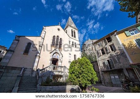 Castellane village church under blue summer sky