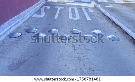 Stop street and speed bumps at the parking lot.