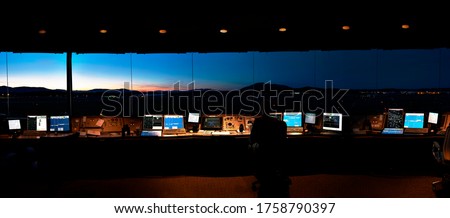 Panorama view from inside an air traffic control tower taken at night, Canada Royalty-Free Stock Photo #1758790397
