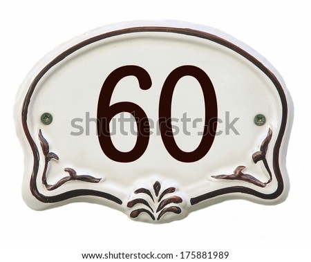 White ceramic decorated tile showing the number 60