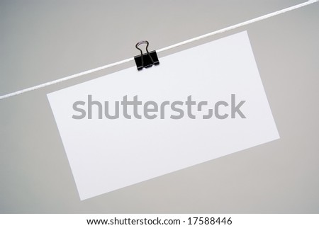 Sheet of paper for notes hanging on rope