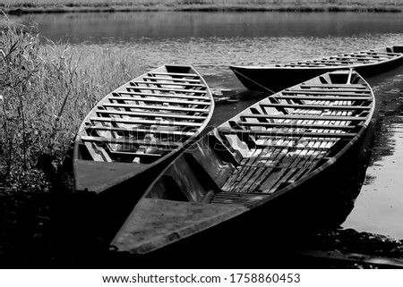 Black and white boats in a river