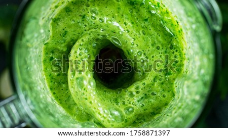 Green fresh smoothie blended in blender, top view. Healthy eating concept. Royalty-Free Stock Photo #1758871397