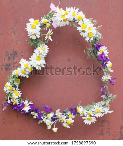 wreath in the form of a heart from spring flowers