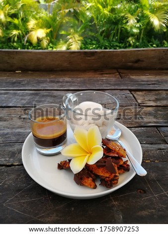 Ice cream coffee in glass on wooden background