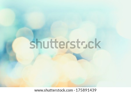 Defocused Bokeh twinkling lights Vintage background. Festive background with natural bokeh and bright golden lights. Royalty-Free Stock Photo #175891439