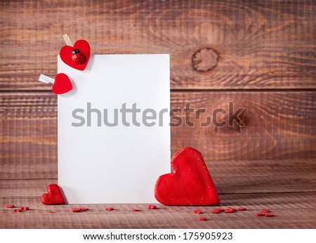 card with hearts on a wooden background 