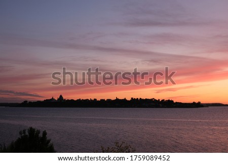 summer landscape: water surface on sunset background selective focus 