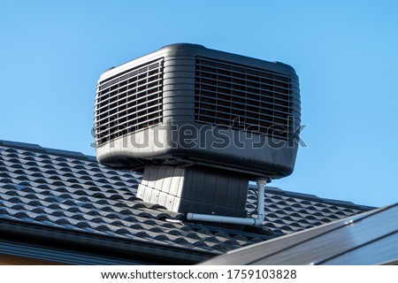 Evaporative Cooler Installed on Roof Royalty-Free Stock Photo #1759103828