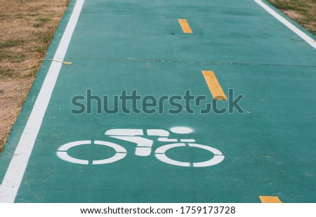 Bike lane sign in park,soft focus.