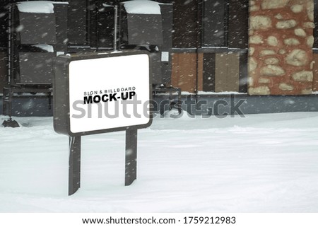 Mock up blank outdoors signboard with clipping path on metal pole for advertising poster at street on winter day, empty space for insert advertising or announcement information 