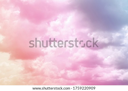 Colorful puffy fluffy cloud & cotton candy cloudscape on sunrise or sunset sky in tropical summer or spring sunlight & sun ray with gradient colors of blue, pink, purple, white & gray, surreal concept Royalty-Free Stock Photo #1759220909