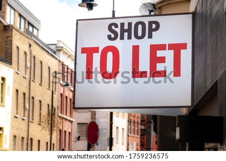 'Shop To Let' sign on city street