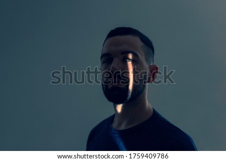 Portrait of a man with leak of light Royalty-Free Stock Photo #1759409786
