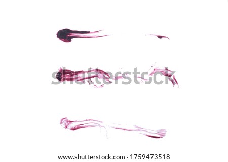 Lipgloss smear samples isolated on a white background. Dark red soft focus makeup texture