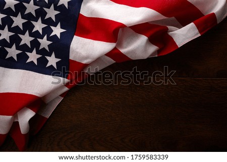 Retro american flyer, 4th of july background. Pride day flag. USA flag on wooden table