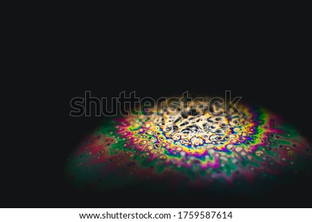 Closeup of a soap bubble on black background