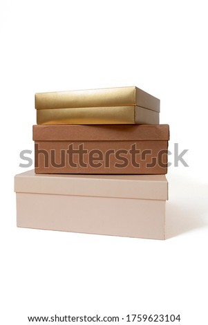 Three isolated boxes standing on each other. Beautifully colored boxes stack
