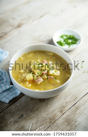Traditional pea soup with smoked bacon