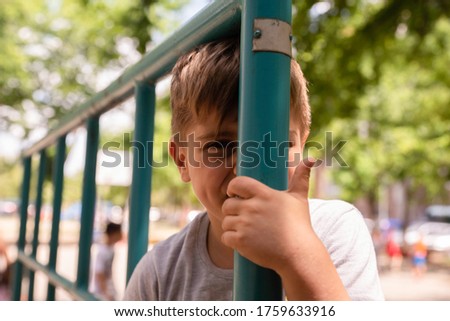 Boy is having fun on an outdoor playground