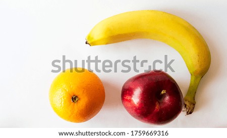 Top view of colorful fresh and delicious banana apple and orange isolated on a full white background