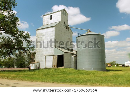 Feed Mill of South Dakota.  Showing the classic Americana feel of the open road with it's steel ribbed siding and faded signage.