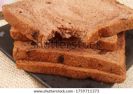 Chocolate white bread with a glass of hot milk