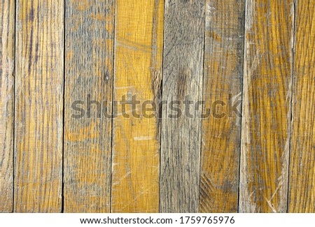 A old dirty brick parquet. Rough surface texture. Parquet with stains of paint and dirt. Natural wood texture for background. Copy space. Wood texture background surface with old natural pattern.