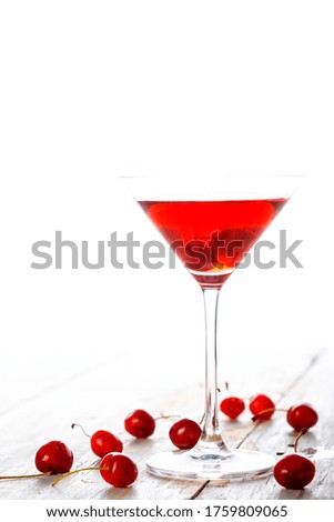 fresh red cherry juice in a wine glass 