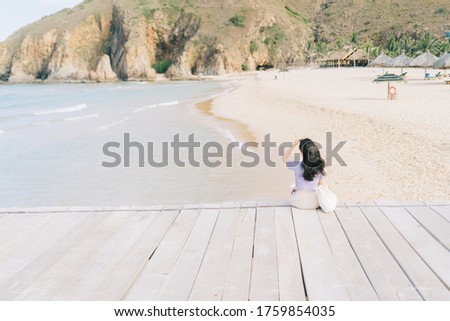 A picture of Asian woman  travel to Ky Co beach, Quy Nhon City, Binh Dinh province, Vietnam