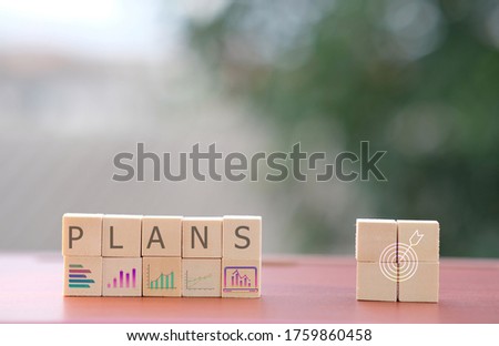 Business process management, Businessman plan a project with wood cubes with icon business strategy and plan growth and increase of positive indicators in his business