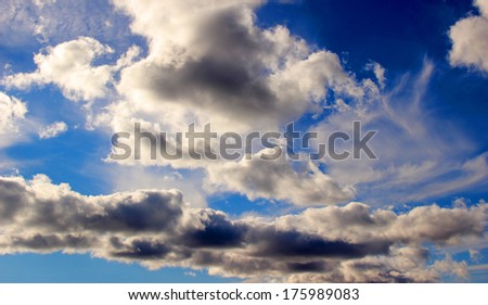 Heavy clouds in the bright blue sky