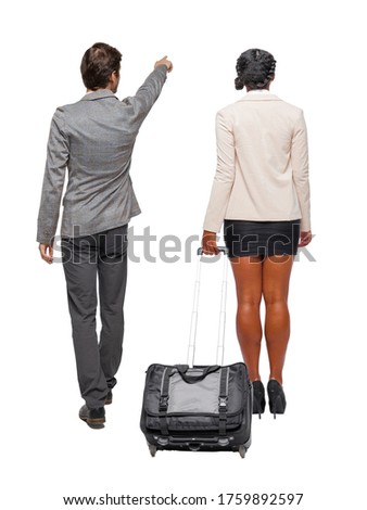 Back view of  two business people in suit pointing. Business team. traveling with suitcas. Back view. Rear view people collection. backside view of person. Isolated over white background.