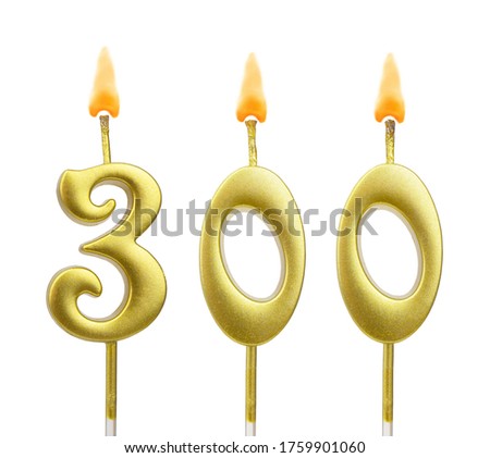 Gold birthday candles isolated on white background, number 300