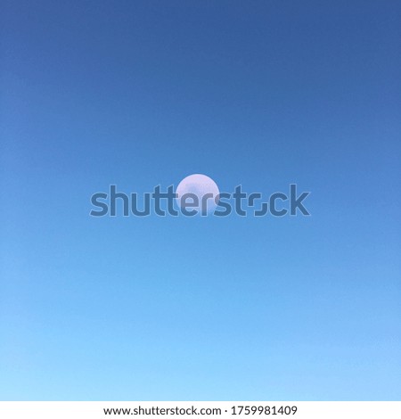 Moon shining bright on a clear sky
