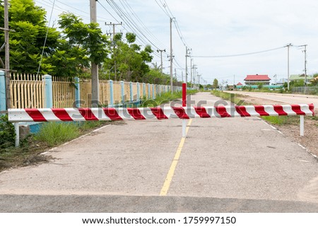 The barrier close the road. loses the passage for cars. Traffic forbidden road sign on a main road.Protected area, entrance is prohibited, passage