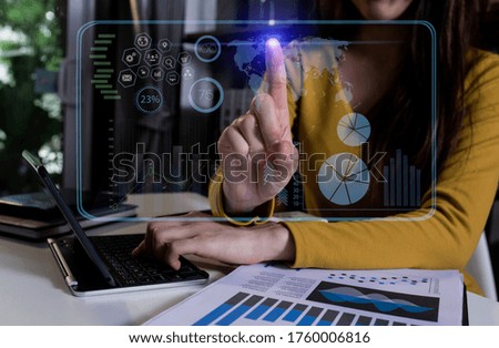 Double exposure of businesswoman hand touch business financial virtual chart, Digital marketing concept. Background toned image blurred.