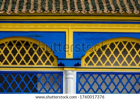 Moorish architecture in yellow and blue colors and arch