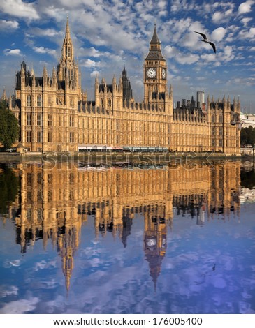 Big Ben with river in London, UK Royalty-Free Stock Photo #176005400