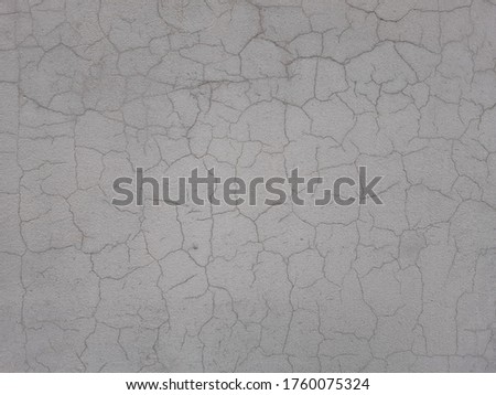 Photo of the cracked wall grey texture
