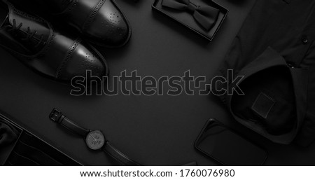 Elegant man clothes concept. Set of black wardobe and accessories for official party evening meeting Royalty-Free Stock Photo #1760076980