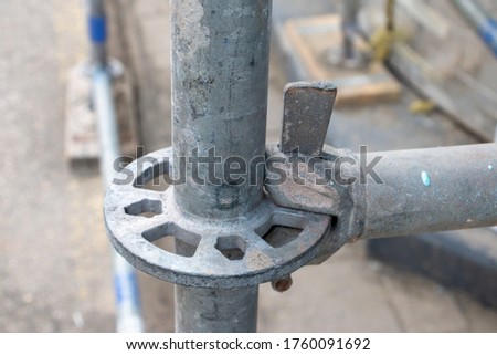 Scaffolding connections in an industrial area, scaffolding posts of reinforced aluminum. Royalty-Free Stock Photo #1760091692