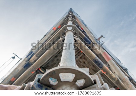 Scaffolding connections in an industrial area, scaffolding posts of reinforced aluminum. Royalty-Free Stock Photo #1760091695