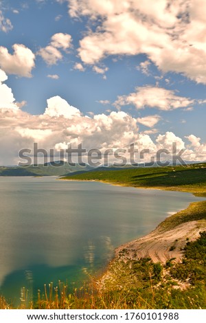 Time lapse vertical photography of the lake and clouds