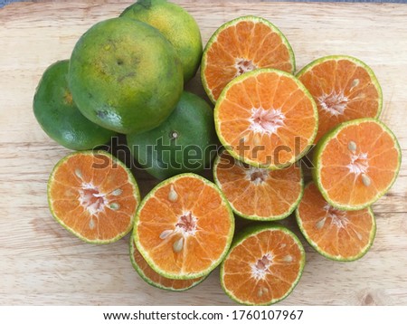 Fresh orange slices on a wooden