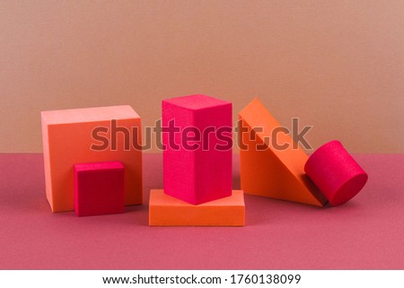Red and orange geometric shapes on a brown background. Template composition for advertising, products.